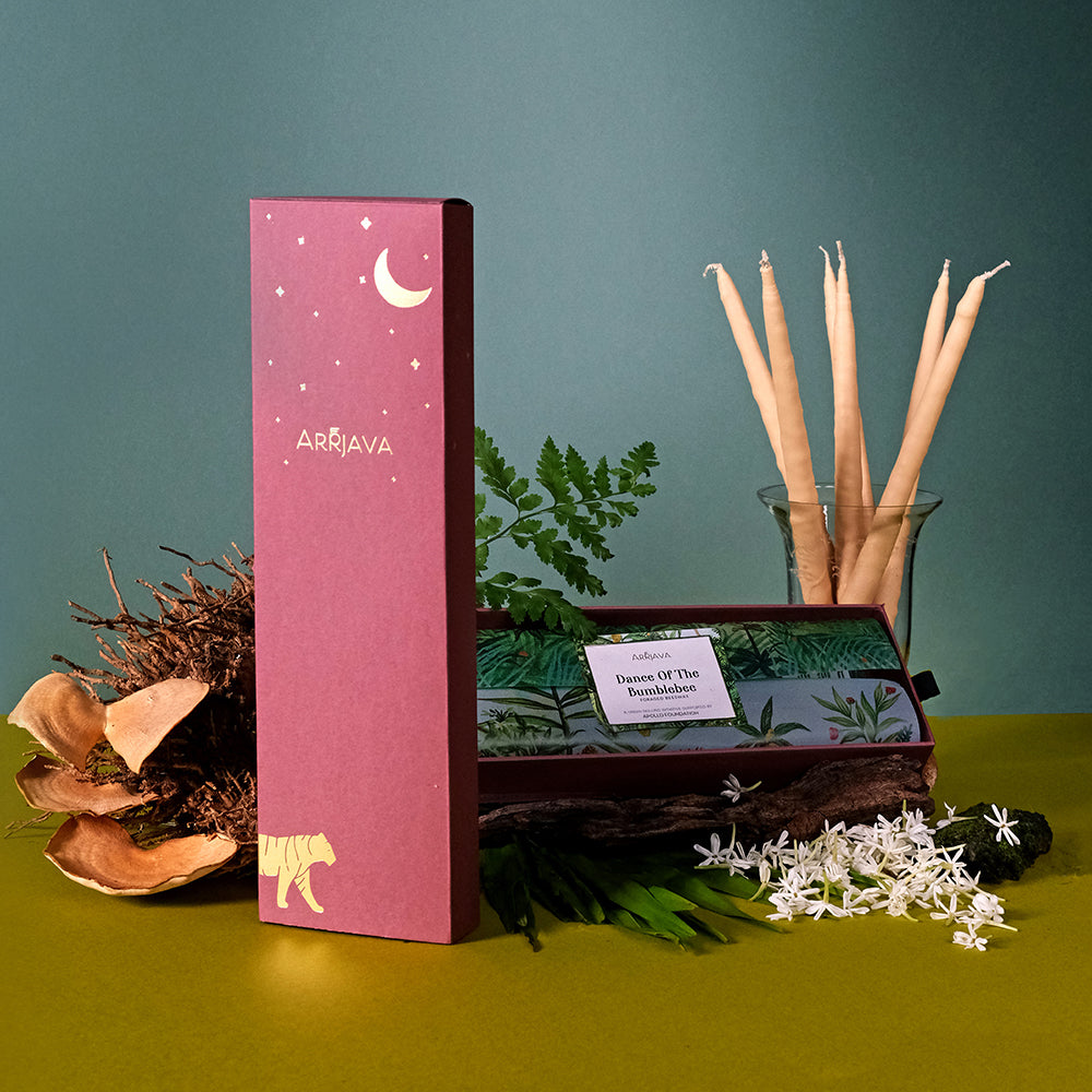Elegant beeswax taper candles hand-rolled in the forest